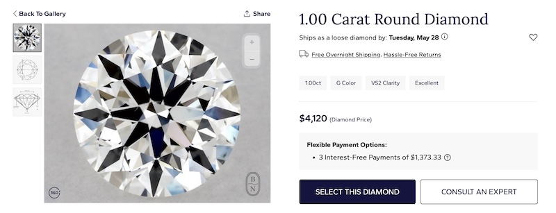 A 1.00 carat round diamond displayed on Blue Nile's website. The diamond is priced at $4,120 and features G color and VS2 clarity with an excellent cut. The image shows a detailed close-up of the diamond, highlighting its brilliance and facets.