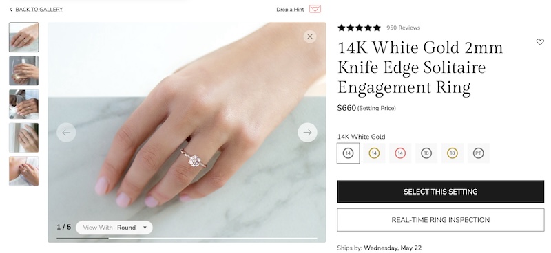 A 14K white gold 2mm knife edge solitaire engagement ring displayed on James Allen's website. The ring setting is priced at $660 and shown on a hand, highlighting its elegance and simplicity. The setting features a 2mm band width and can be customized with different metal options.